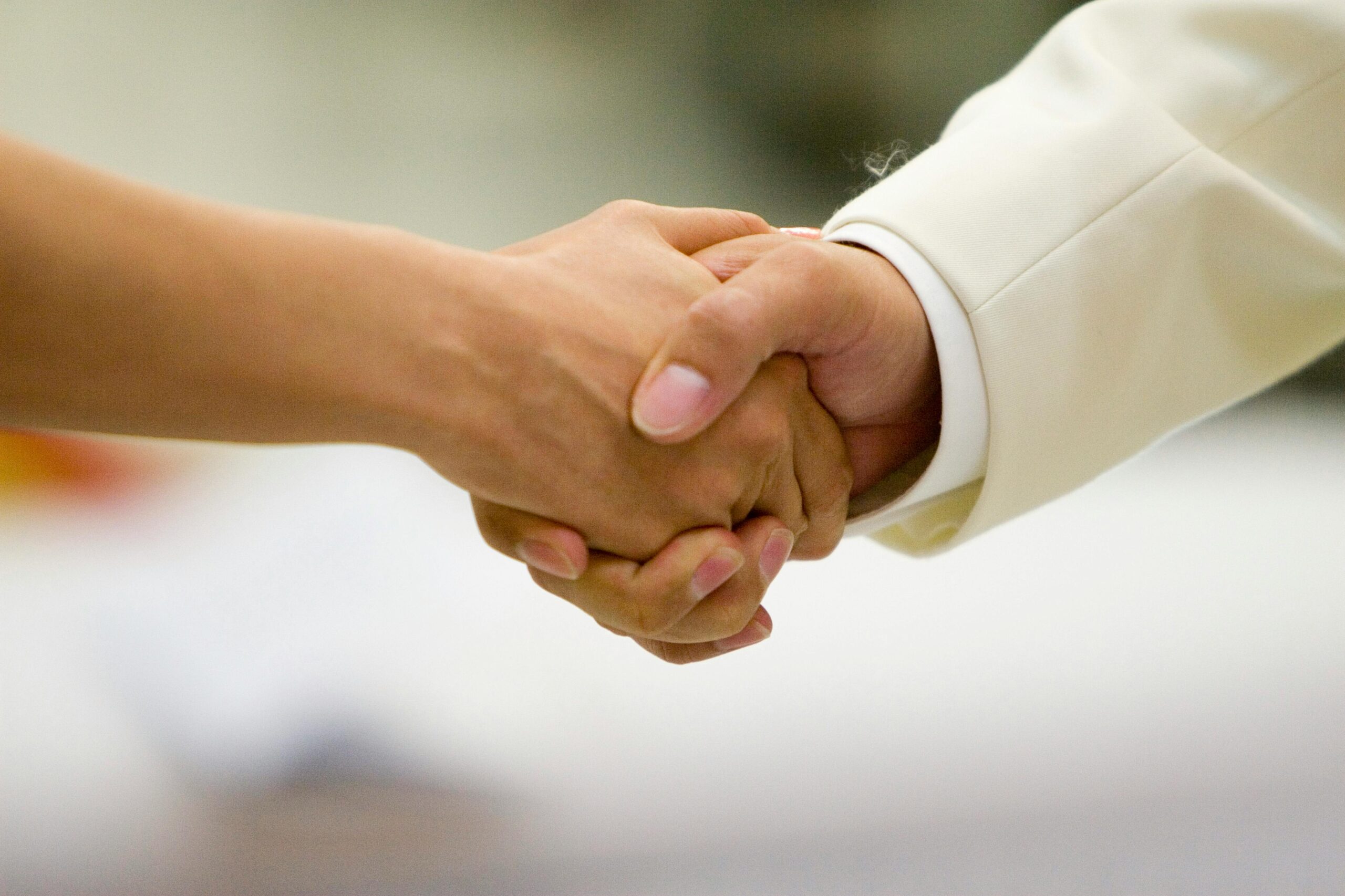 Nosotros An intimate moment capturing a couple holding hands, symbolizing love and unity during a wedding ceremony.